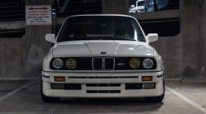 BMW E30 M3 in a parking garage.