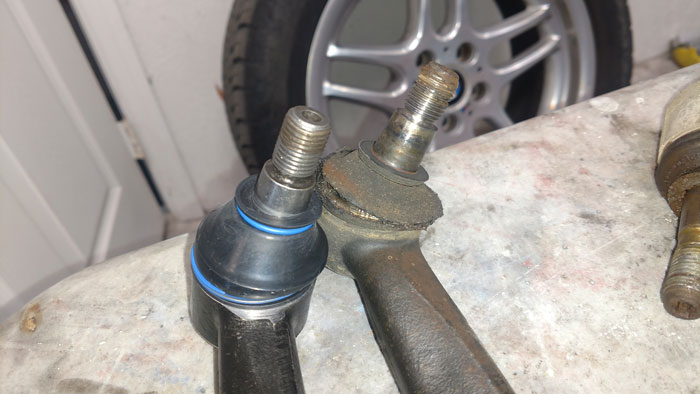 Here is a new ball joint compared to an old one with a torn boot.