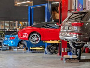 Porsche 911 lifted up for servicing at Eurospec Autowerks.