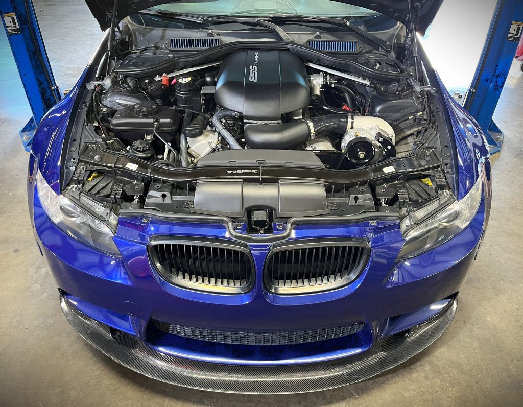 Engine bay picture of an BMW E92 M3 with a ESS supercharger kit installed.