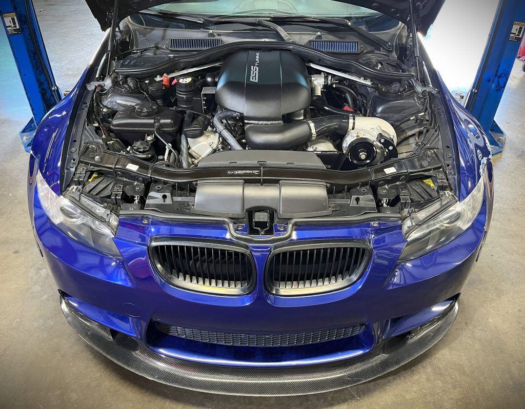 Engine bay picture of an BMW E92 M3 with a ESS supercharger kit installed.