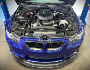 Engine bay picture of an BMW E92 M3 with a ESS supercharger kit installed.