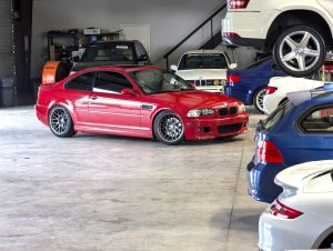 Imola Red E46 M3 in the shop at Eurospec Autowerks.