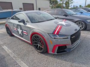 Wrapped Audi TT RS parked outside at Eurospec Autowerks European Auto Repair.
