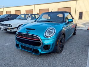 Mini Cooper JCW convertible parked in front of Eurospec Autowerks.